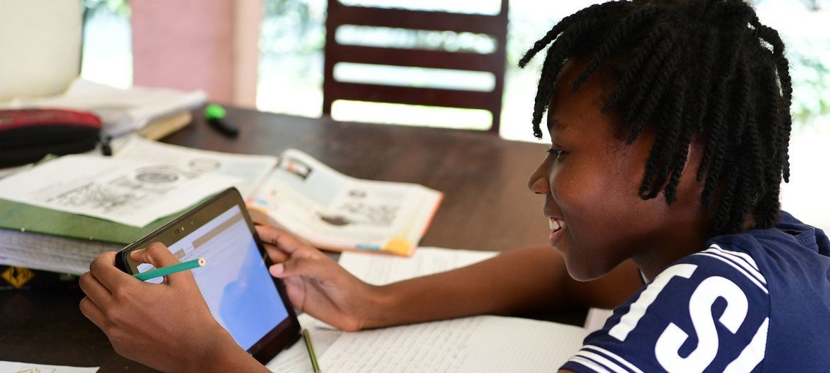 A girl studies online at home in Abidjan in Côte d'Ivoire.