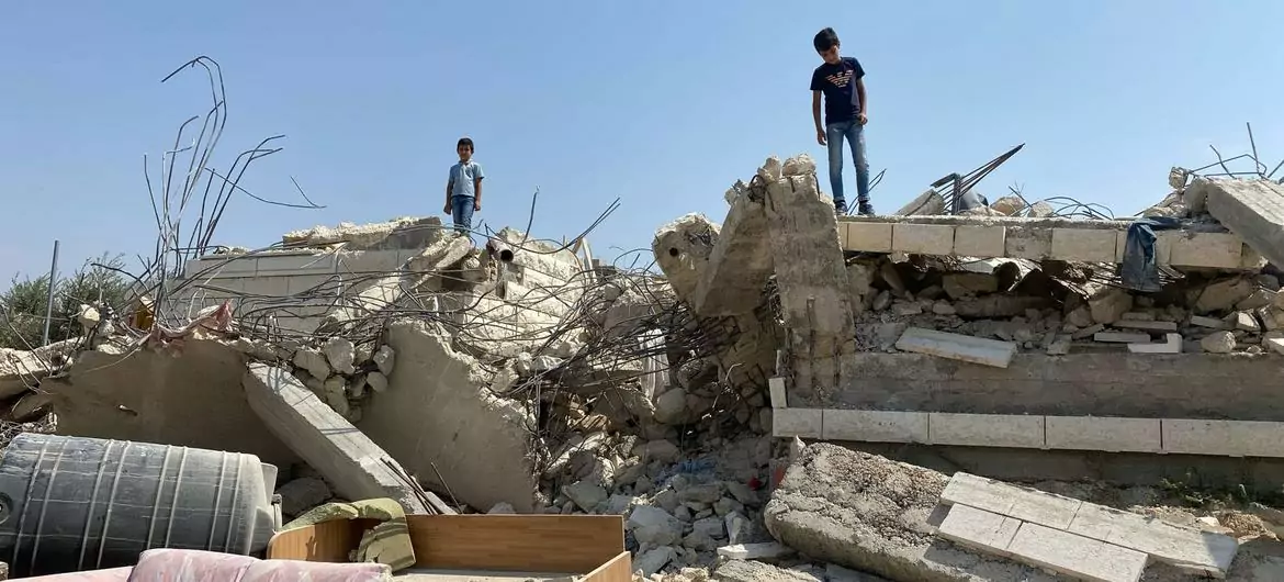 Children stand on a home demolished in Beit Sira, a Palestinian village in the central West Bank. Children stand on a home demolished in Beit Sira, a Palestinian village in the central West Bank.
