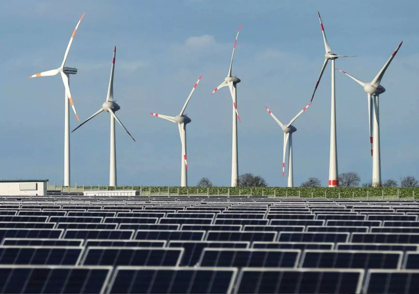 Wind farms and solar panels generate electricity and reduce reliance on coal-powered energy. Wind farms and solar panels generate electricity and reduce reliance on coal-powered energy.