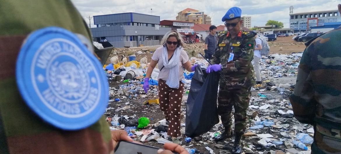 Climate scientist Shazneen Cyrus Gazdar (centre) and UN peacekeepers participate in a clean-up event in Juba, South Sudan, on World Environment Day in June 2023.